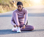 Fitness, road and black woman tie shoes on street to get ready for running, exercise or workout. Sports athlete, training and female runner tying sneakers to start exercising, cardio or jog outdoors.