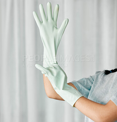 Buy stock photo Cleaning gloves, hands and woman in a home ready to start bacteria and mess removal for safety. House, cleaner and maintenance of a female housekeeping employee with rubber glove for clean household