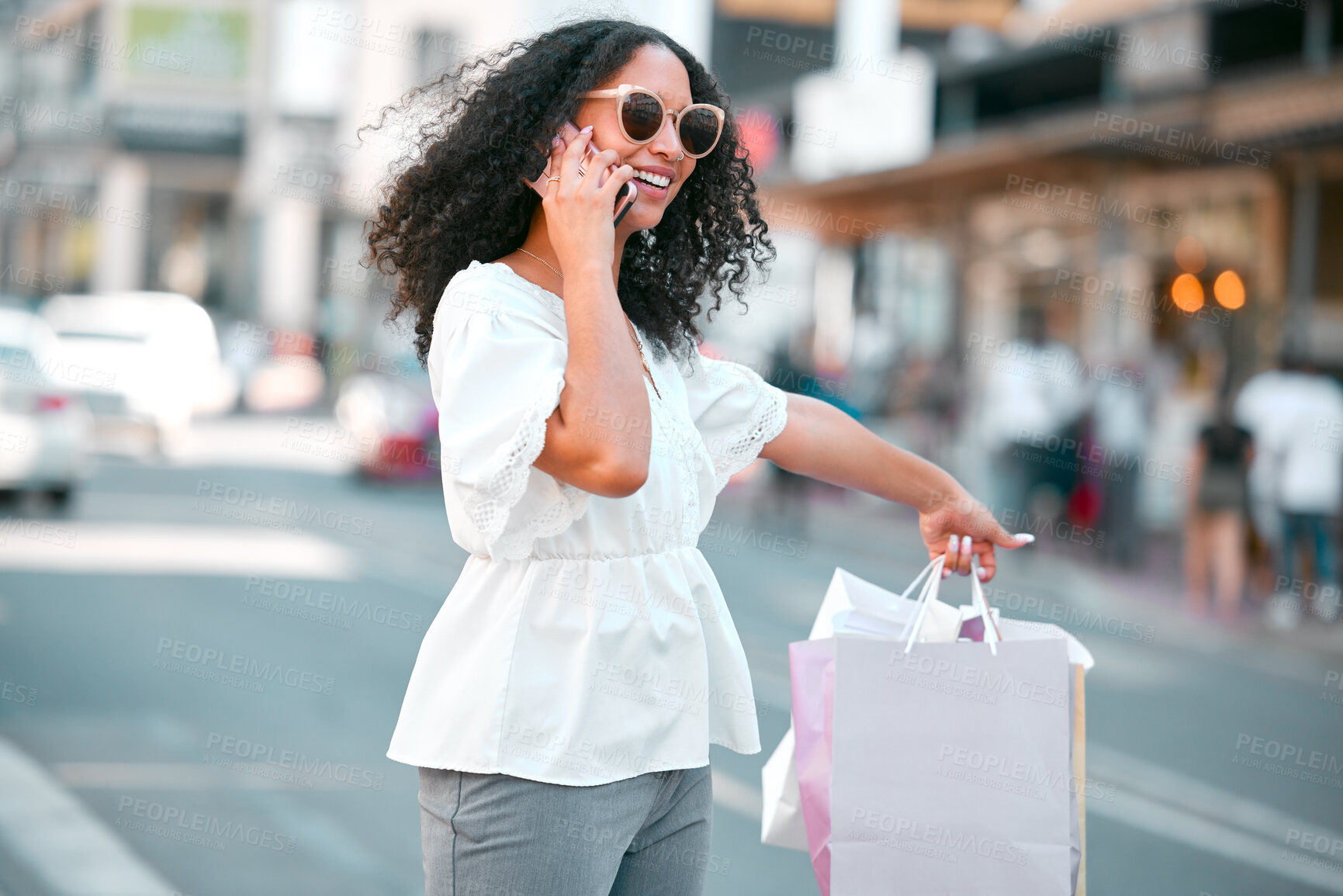 Buy stock photo Taxi request, shopping bags and woman with phone call in the city standing in the street. Girl smile with gifts, 5g mobile in hand or smartphone in London road travel happy from sale or discount 