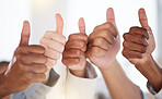 Thumbs up, diversity and people with success in the office for team building, collaboration or teamwork. Multiracial, business and hands of employees with an agreement, yes or ok gesture in workplace