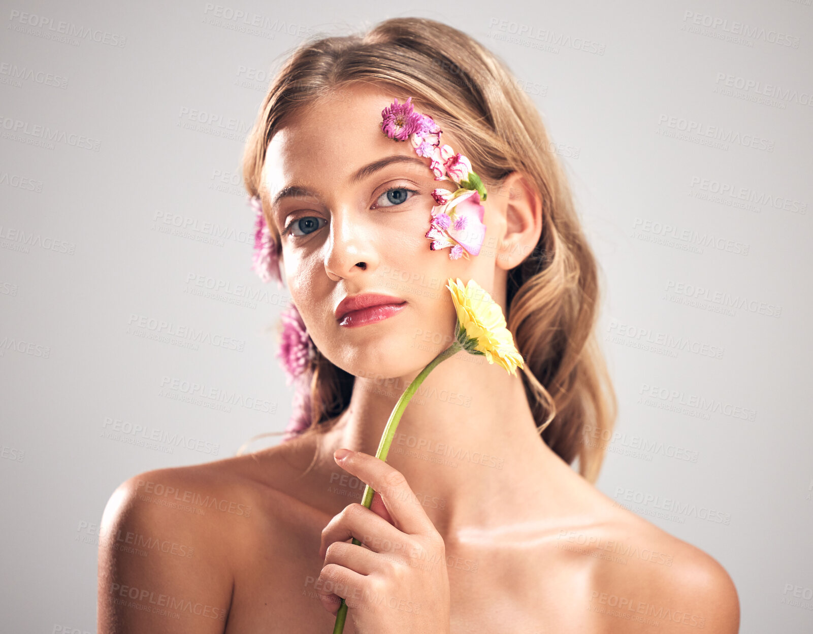 Buy stock photo Beauty, flower and portrait of woman in studio with a skincare, natural and face routine. Floral, health and female model with organic, self care and fresh skin or facial treatment by gray background