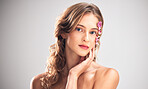 Beauty flowers, face portrait or woman with floral product, sustainable agriculture and relax natural skincare. Facial makeup, nature plant cosmetic or eco friendly girl isolated on studio background