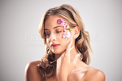 Buy stock photo Beauty, flower pattern and face of woman for natural cosmetics, skincare wellness and makeup products. Spring, art and girl with petals for spa aesthetic, luxury facial and cosmetology in studio