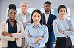 Portrait, arms crossed and leadership of Asian woman with business people in office for company goals. Teamwork, diversity and group of employees with confident female ceo, vision and success mindset
