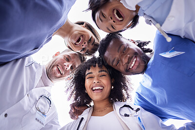 Buy stock photo Doctor, group portrait and below circle for motivation, support and collaboration with smile, solidarity and diversity. Friends, doctors and face with teamwork, goals and help in healthcare at clinic