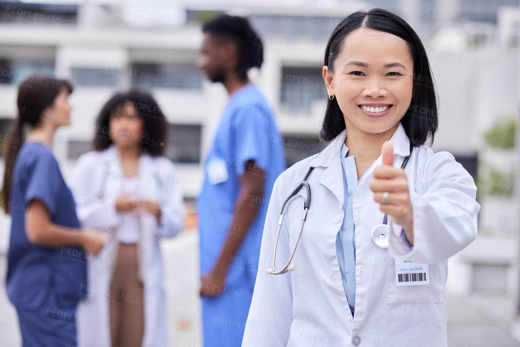 Buy stock photo Thumbs up, leadership and portrait of a female doctor standing outdoor of the hospital. Happy, smile and professional Asian woman healthcare worker with success or agreement gesture in medical clinic
