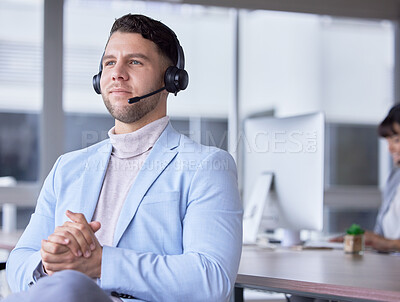 Buy stock photo Callcenter, focus or business man with microphone for customer support, consulting or networking in office. Thinking, CRM or focus sales advisor on tech for telemarketing, focus or telecom contact us