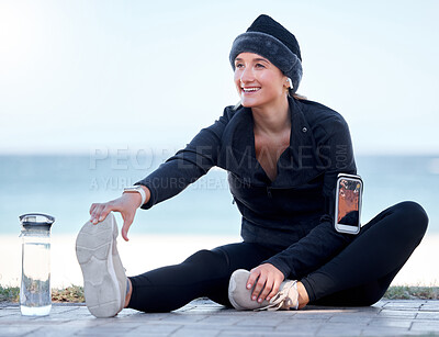 Buy stock photo Fitness, woman and stretching legs by beach in preparation for exercise, cardio workout or training. Happy sporty female in warm up leg stretch getting ready for fun exercising by the ocean on mockup