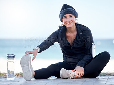 Buy stock photo Fitness, woman and stretching legs by beach in preparation for exercise, cardio workout or training. Portrait of happy female in warm up leg stretch ready for fun exercising by the ocean on mockup