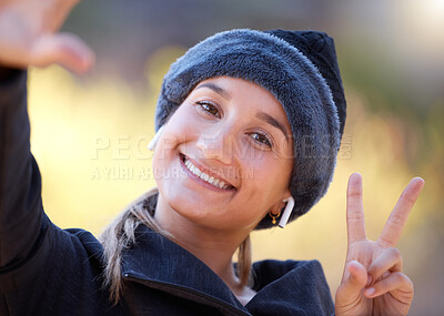 Buy stock photo Portrait, woman and peace sign for support, smile and community outdoor, wellness and cheerful. Face, female and lady with gesture for solidarity, success and motivation with joyful, girl and outside