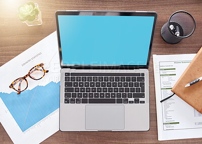 Buy stock photo Mockup, green screen and documents with laptop on desk from above for finance planning, investment and review. Accounting, technology and overhead with device for growth, savings and tax report