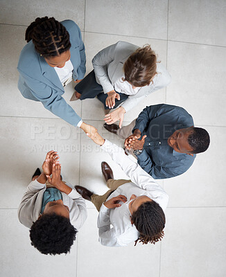 Buy stock photo Handshake, applause and business people in a office with thank you and welcome to a meeting. Onboarding, shaking hands and corporate partnership agreement from above of advertising team with b2b deal