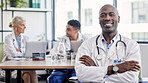 Arms crossed, portrait and a doctor in healthcare meeting with vision, motivation and confidence. Happy, medicine and an expert African man in medical workshop, seminar or conference at a hospital