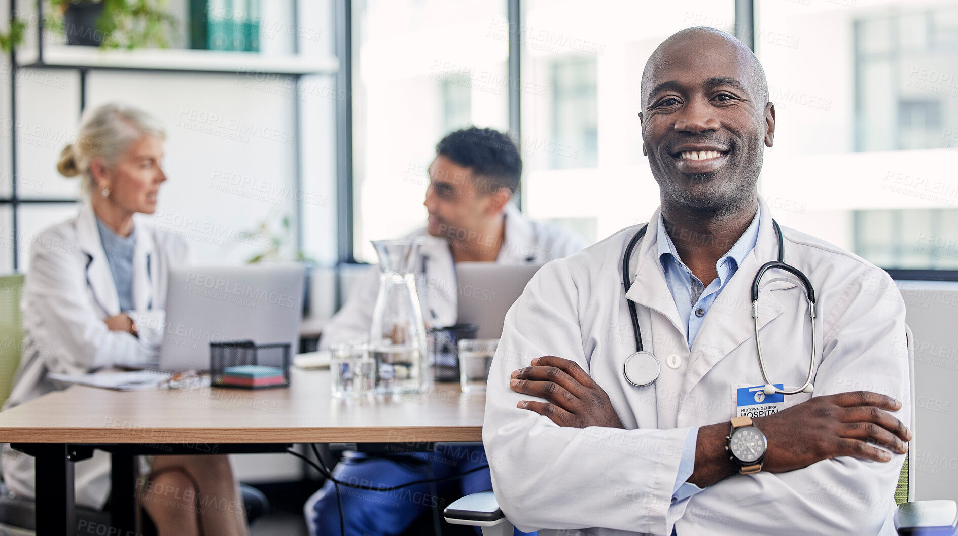 Buy stock photo Arms crossed, portrait and a doctor in healthcare meeting with vision, motivation and confidence. Happy, medicine and an expert African man in medical workshop, seminar or conference at a hospital