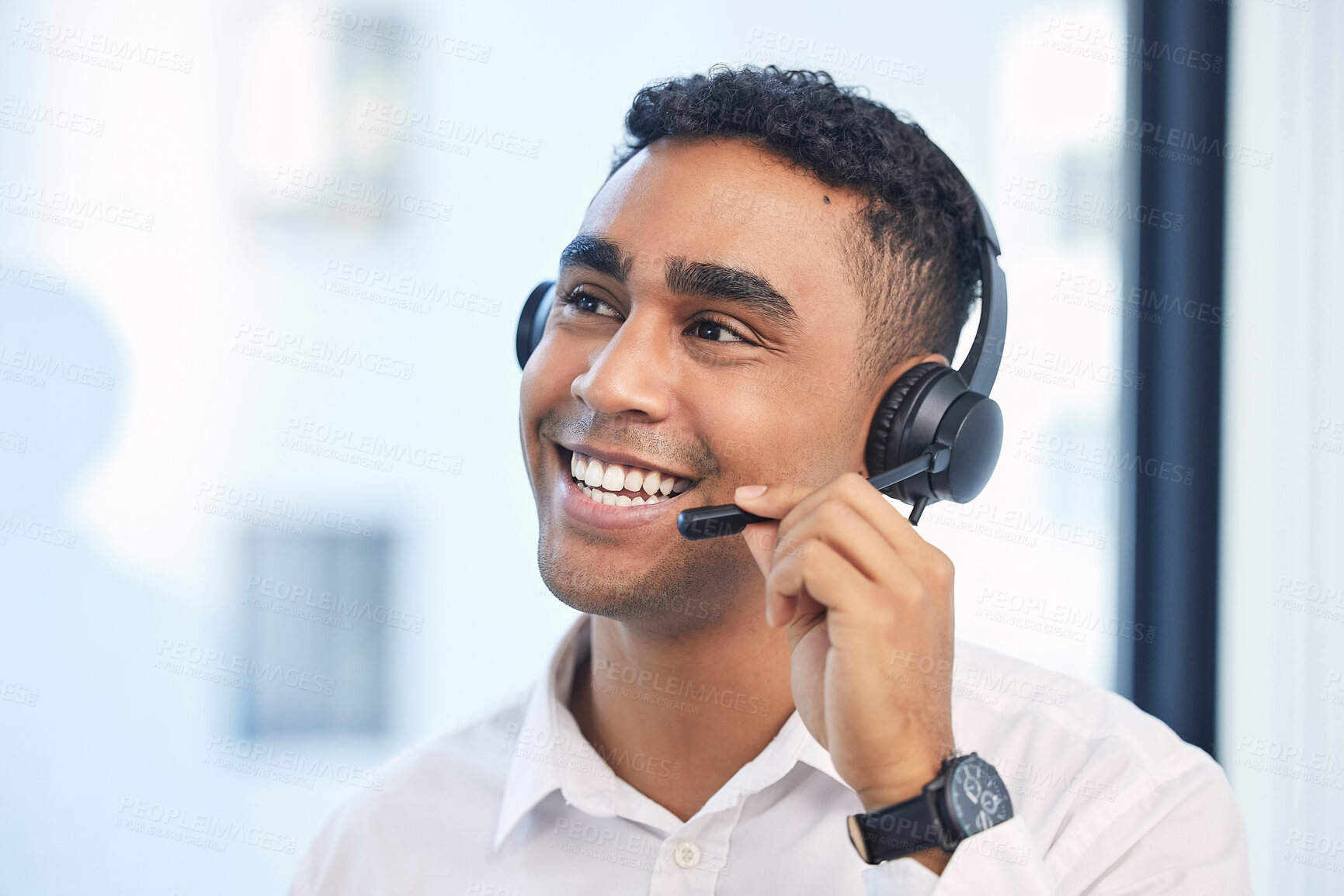 Buy stock photo Call center, consulting and smile with man in office for customer support, telemarketing or communication. Sales, advice and happy with employee for help desk, contact us and advertising agent