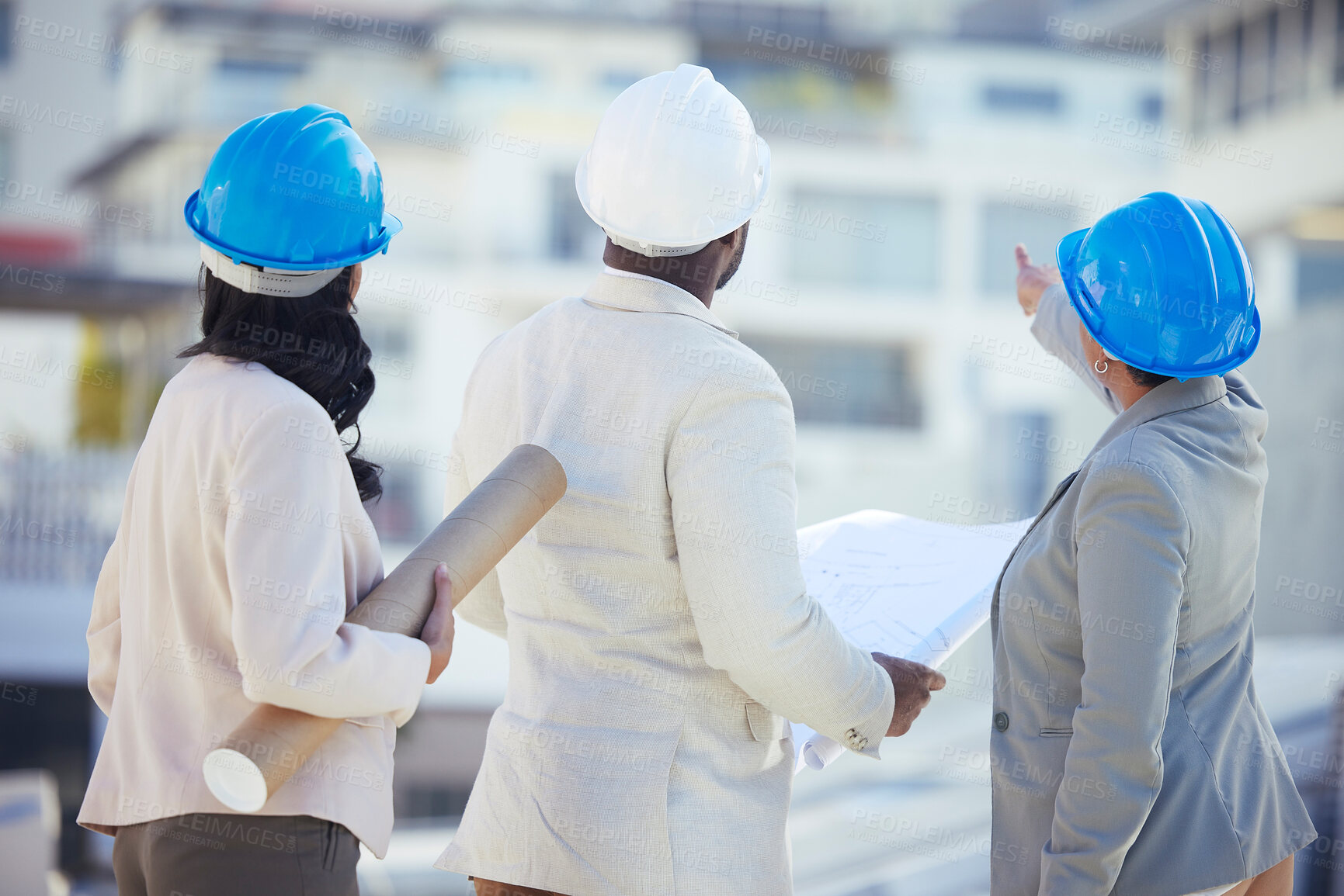 Buy stock photo Engineering, collaboration or team on construction site with an blueprint for real estate development. Industrial, architecture or back view of group planning a building renovation project in meeting