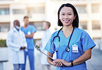 Checklist, portrait and happy doctor or woman with hospital leadership, workflow management and surgeon schedule. Face of healthcare worker, nurse or asian person for medical services and paperwork
