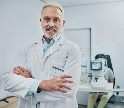 Buy stock photo Man, portrait and smile of optometrist with arms crossed in hospital or medical clinic for eye care. Healthcare, vision or happy, confident or proud senior male ophthalmologist or doctor of optometry