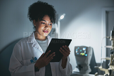 Buy stock photo Medical doctor, tablet and black woman in hospital for online consultation, research or telehealth at night. Healthcare, technology and female physician with touchscreen for wellness app in clinic.
