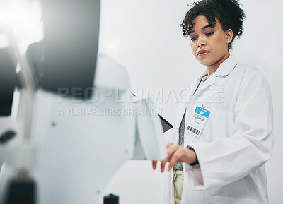 Buy stock photo Healthcare, machine and black woman in laboratory, check experiment and wellness with focus. Medical professional, African American female employee or researcher with lab equipment, testing or typing