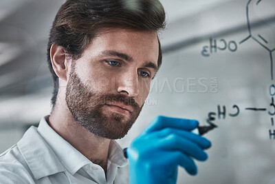 Buy stock photo Serious, science and chemistry with man writing in laboratory for medicine, pharmacy and healthcare. Research, analytics and medical with expert solving on glass board for idea, study and data