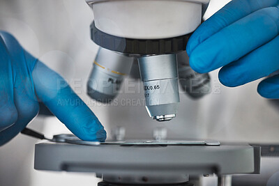 Buy stock photo Science, microscope and hands for research and analysis by doctor or scientist in laboratory. Zoom on medical dna, particle or bacteria to study for biotechnology, medicine and innovation development