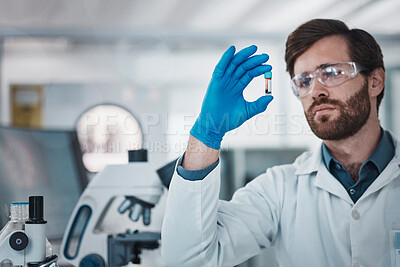 Buy stock photo Science, blood and dna with a doctor man at work in a laboratory for analysis or research. Medical, innovation and sample with a male scientist working in a lab for development or breakthrough