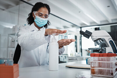 Buy stock photo Science, covid or sanitizer with a doctor black woman at work in a laboratory to sterlize her hands. Medical, health and safety with a female scietist working in a lab for research or innovation