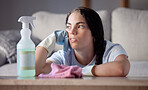 Spray bottle, tired and woman in lounge, thinking and cloth with depression, stress and overworked. Female cleaner, maid and lady in living room, disinfectant and spring cleaning home, rag or burnout