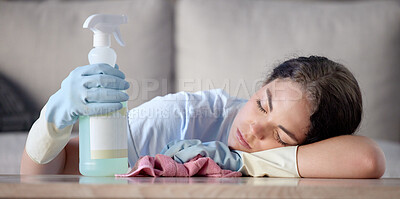 Buy stock photo Tired woman, housekeeping and sleeping on table with detergent bottle by the living room sofa at home. Female exhausted from spring cleaning, burnout or nap after disinfection with sanitizer bottle