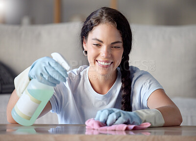 Buy stock photo Cleaning, nanny and woman spray a table surface to remove bacteria and dirt for hygiene in a home, house or apartment. Young, female and cleaner with detergent or soup to wipe desk clean