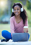 Headphones, black woman and portrait of a student in a park listening to music and web audio. Computer, outdoor studying and streaming online radio with happiness and blurred background in morning