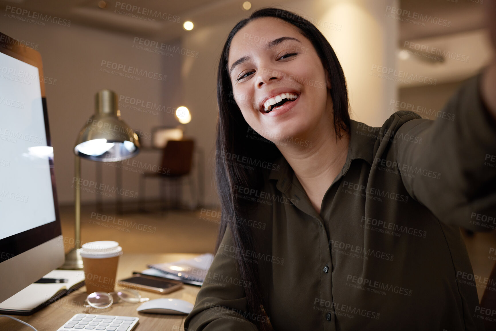 Buy stock photo Night, selfie and happy with woman in office for social media, internet and smile. Designer, website and technology with employee at desk and working overtime for networking app and blog