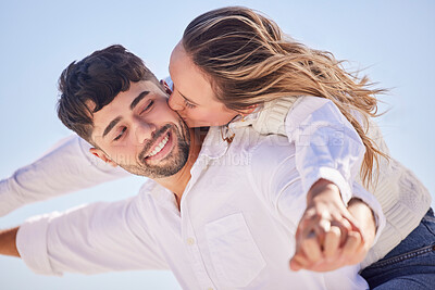 Buy stock photo Piggyback, relax or couple love to kiss on holiday vacation or romantic honeymoon in a marriage commitment. Travel, trust or woman bonding, kissing or hugging a happy partner in fun summer romance 