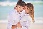 Love, dance and happy with couple on beach for date, romance and anniversary celebration. Smile, bonding and affectionate with man and woman on holiday for hug, vacation and happiness together