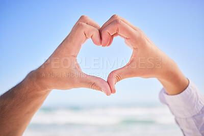 Buy stock photo Love, hands or couple at beach with heart sign on holiday vacation or romantic honeymoon to celebrate marriage Commitment, trust or lovers showing hearty shape emoji or icon in fun summer romance 