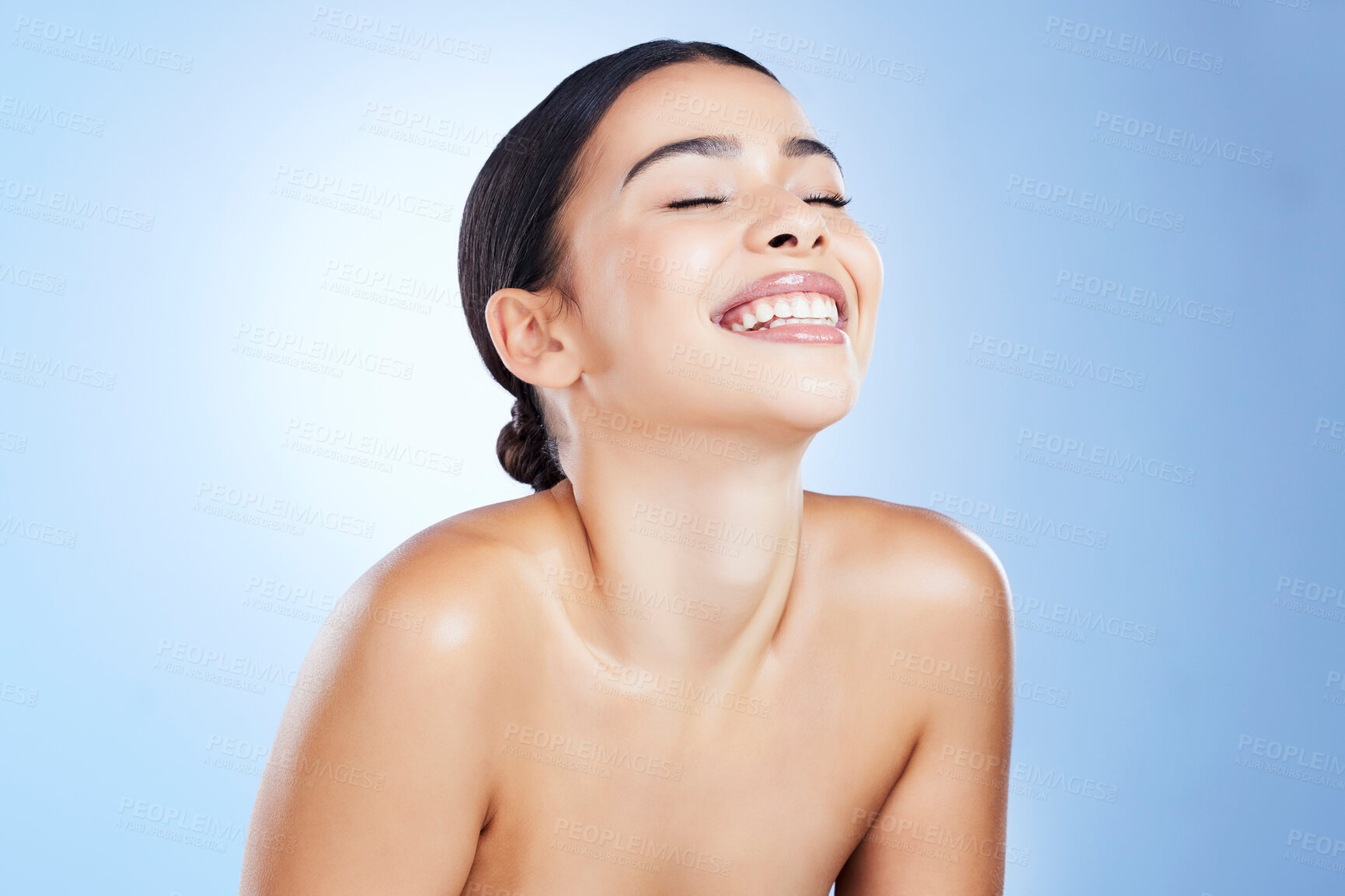 Buy stock photo Skincare, beauty and smile of a woman happy about wellness, facial and dermatology. Isolated, blue background and studio with a young model with happiness from self care and spa treatment detox