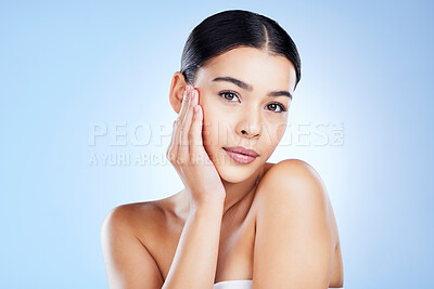 Buy stock photo Portrait, face and aesthetic with a model black woman in studio on a blue background for skincare. Relax, beauty and spa with an attractive young female posing to promote natural skin treatment
