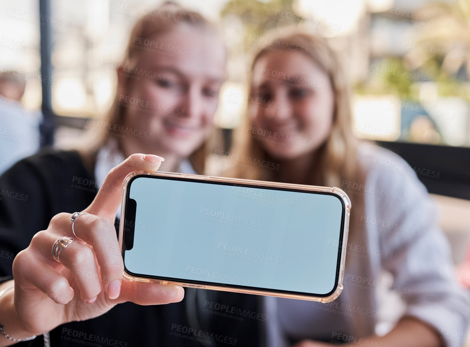 Buy stock photo Selfie, showing and friends with mockup phone for advertising a brand at a restaurant. Marketing, contact and hands of women with a blank mobile screen for a photo, show app and social media at cafe