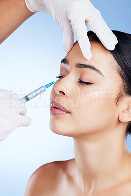 Plastic surgery, surgeon hands and woman for beauty, filler injection and change in studio. Aesthetic model person and doctor for cosmetic surgery, face transformation or dermatology blue background