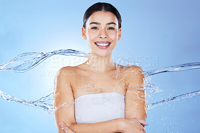 Buy stock photo Water splash, beauty and portrait of woman for happy skincare glow results on blue background. Face of aesthetic model person with spa facial, cosmetics or makeup for health, wellness and dermatology