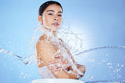Buy stock photo Beauty, skin care and portrait of woman water splash for glow results on blue background. Face of aesthetic model person with spa facial, cosmetics or makeup for health, wellness and dermatology