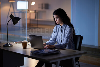 Buy stock photo Laptop, night and business woman typing in office workplace working late on project. Computer, technology and female employee planning, internet browsing and writing research on overtime in company.