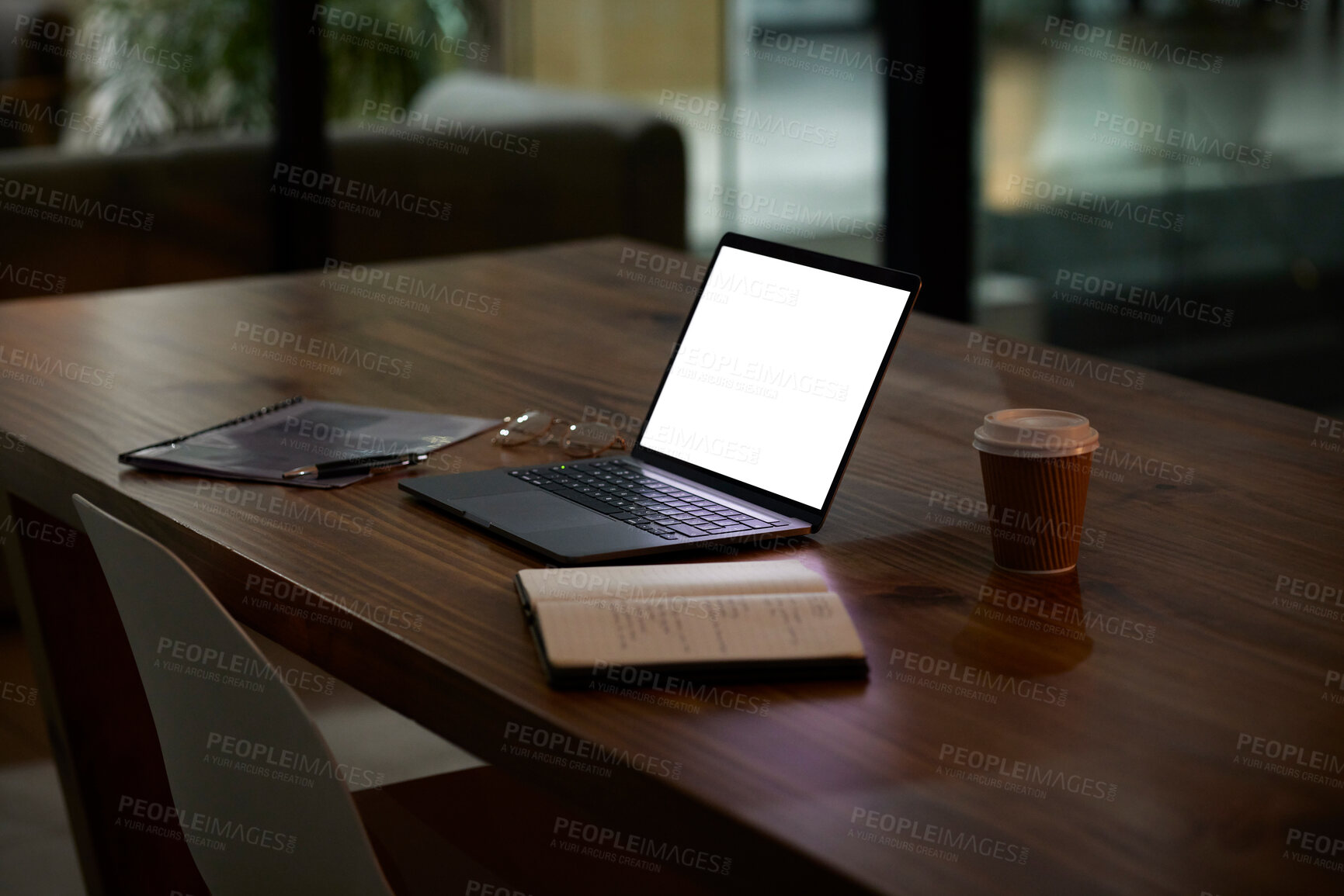 Buy stock photo Night, work and mockup laptop on a table for business, late shift and organized workspace. Planning, corporate and blank computer screen for marketing on a desk for a deadline or overtime in the dark