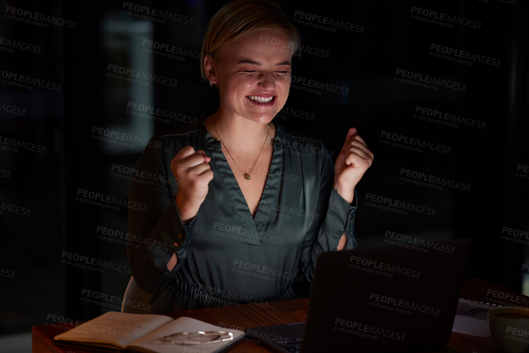 Buy stock photo Night, laptop and woman with achievement, excited and happiness for business deal, sales growth and promotion. Dark, female employee and entrepreneur with device, smile and celebration for good news
