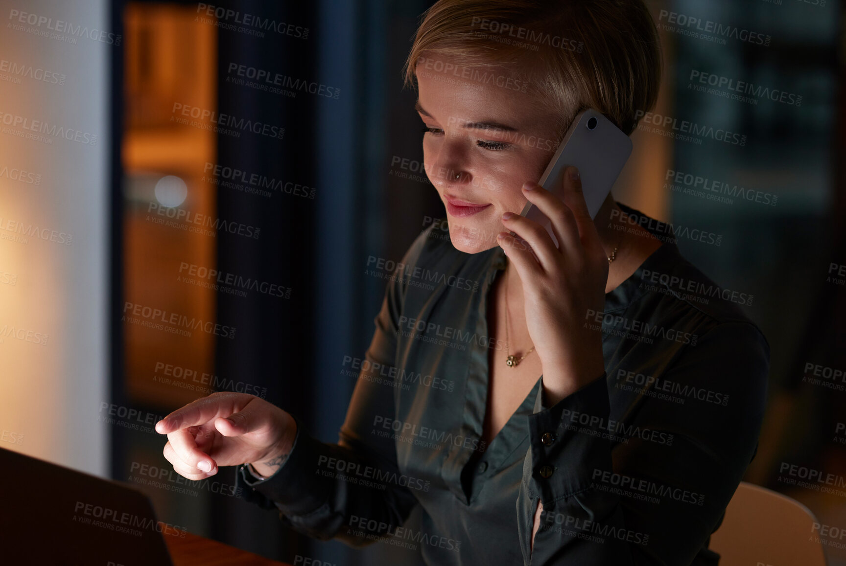 Buy stock photo Overtime, phone call and woman with laptop working late night in dark office, crm and networking in conversation. Technology, communication and happy businesswoman on smartphone and smile at work