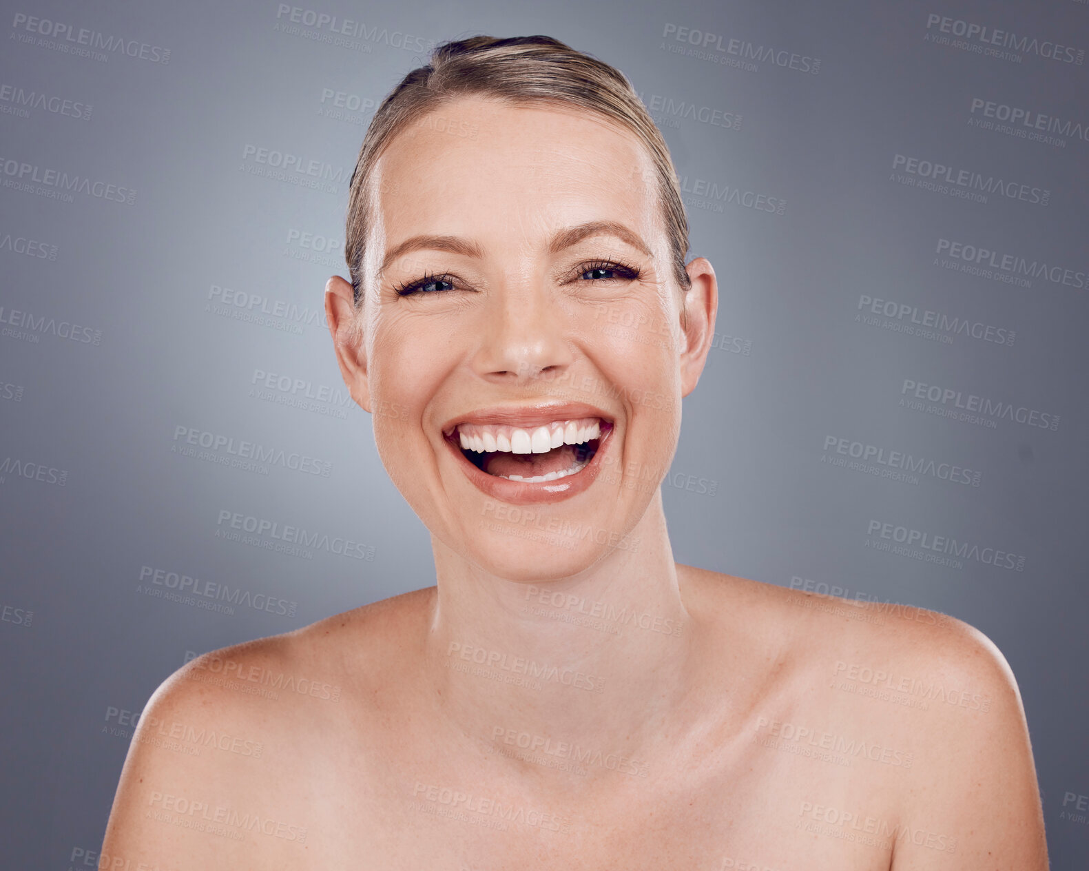 Buy stock photo Skincare, portrait and woman laughing in studio for beauty, dermatology and wellness cosmetics on background. Happy mature female model, smile face and aesthetic shine of facial transformation glow