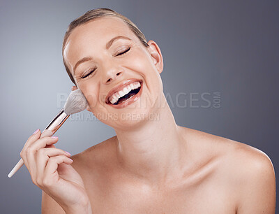 Buy stock photo Face, brush for makeup and woman with laughter, beauty and skin glow, funny and foundation on studio background. Powder, cosmetics tools and skincare, happy model with cosmetology and cosmetic care