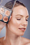 Makeup pallet, woman and face with cosmetics product for beauty, foundation and eye powder on studio background. Smile, cosmetic care and cosmetology, eyeshadow or blush, lashes and advertising