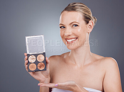 Buy stock photo Makeup pallet, woman in portrait and smile with cosmetics product, foundation and eye powder on studio background. Beauty, cosmetic care and cosmetology, eyeshadow or blush, mockup and advertising